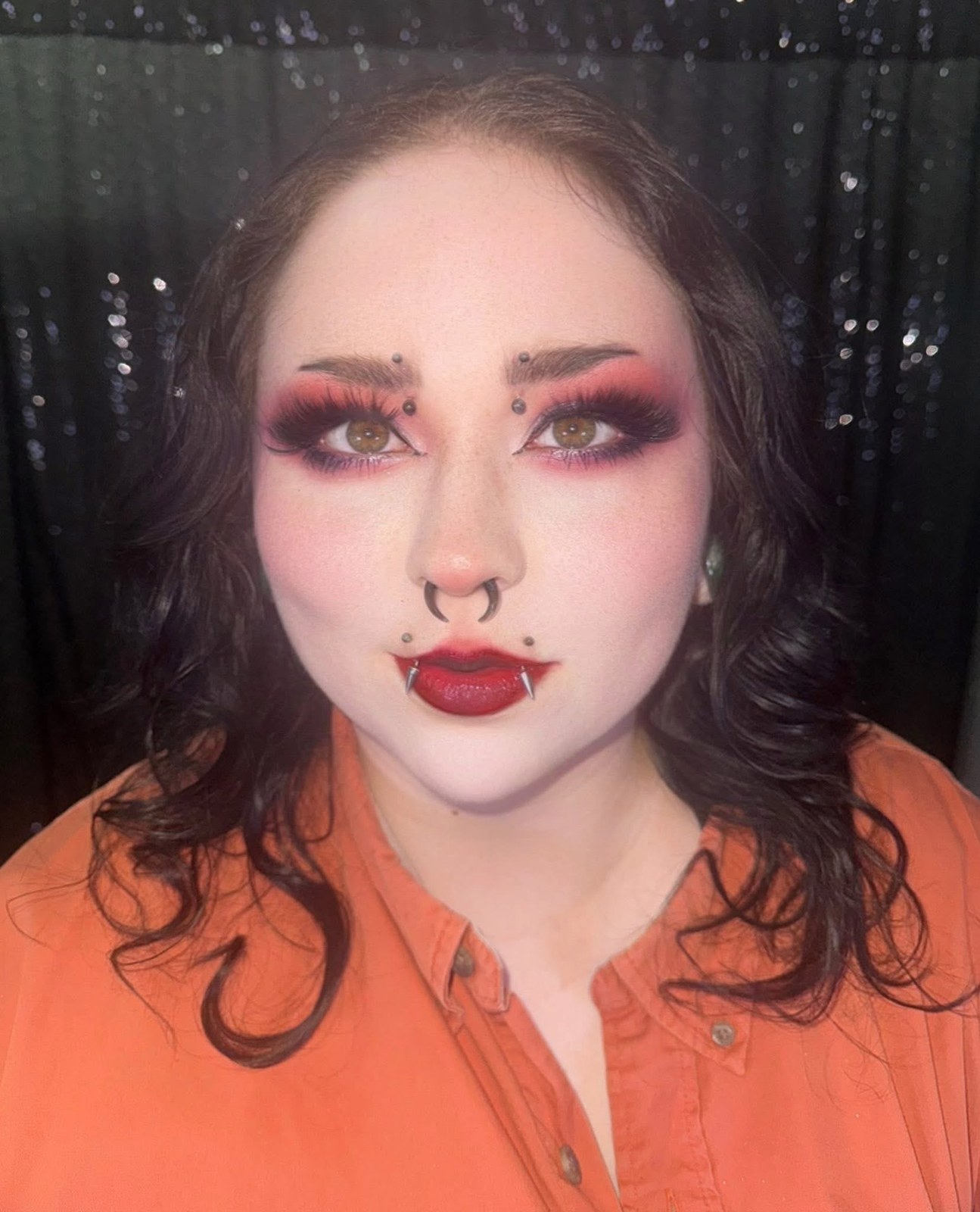Bold pink and plum creative makeup with dramatic lashes