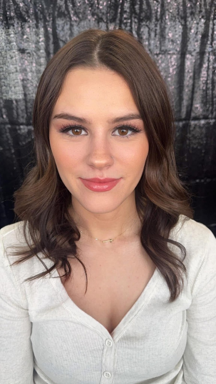 Soft glam with defined lashes and rosy tones
